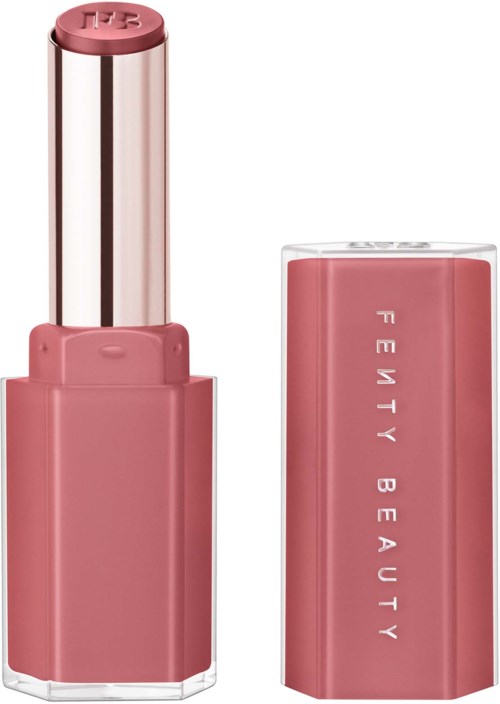 A pink lipstick with the lid removed, showing the shiny, metallic lipstick inside and the brand name on the side.