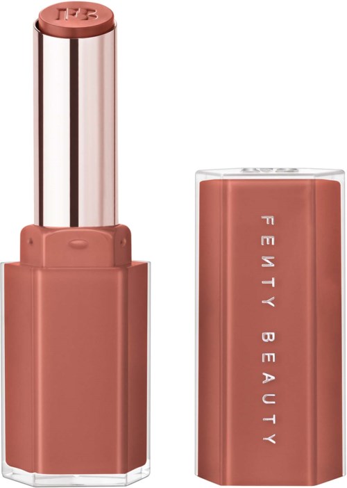 A lipstick with a pinkish-brown shade and a cap with words "Fenty Beauty" on it.