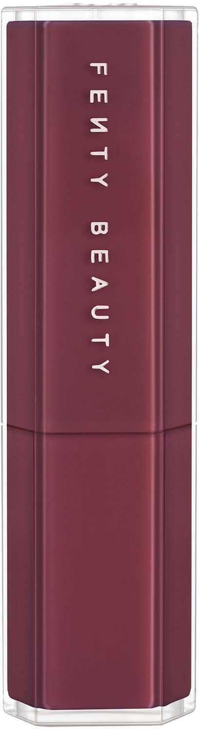 A lipstick tube in dark red with the words "Fenty Beauty" written vertically.
