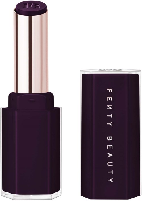 A lipstick with a black and purple case and a shiny gold-colored tube.