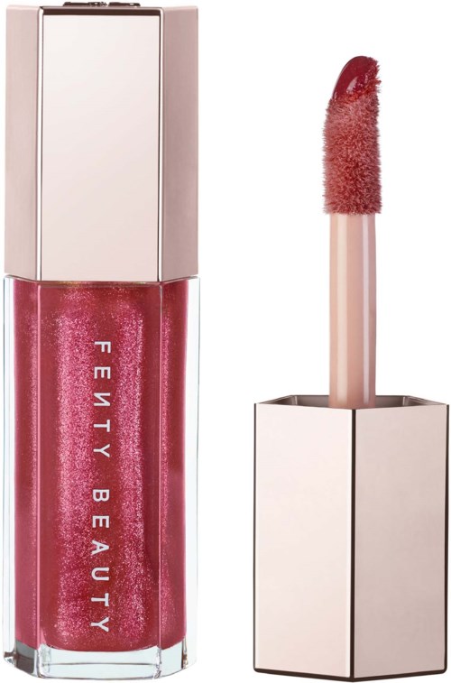 A pink lip gloss with a shiny, sparkly finish and a matching applicator wand.