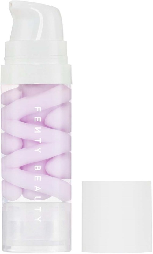 Fenty Beauty skincare product with pink and white capsules in a clear bottle.