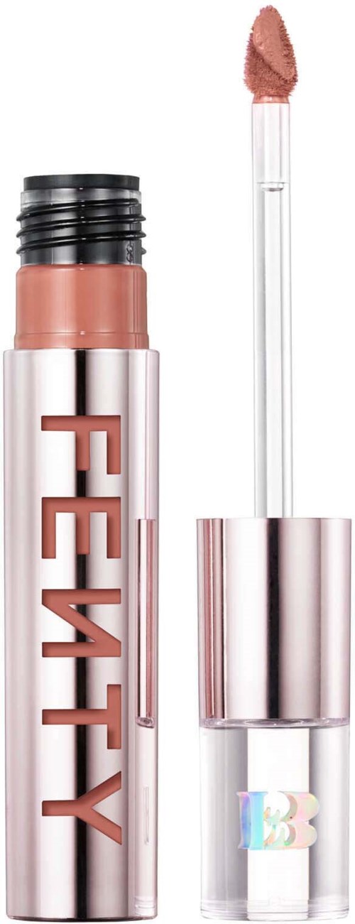A lipstick with a metallic case and the brand name 'FENTY' on it. The cap is removed, showing the lipstick applicator.