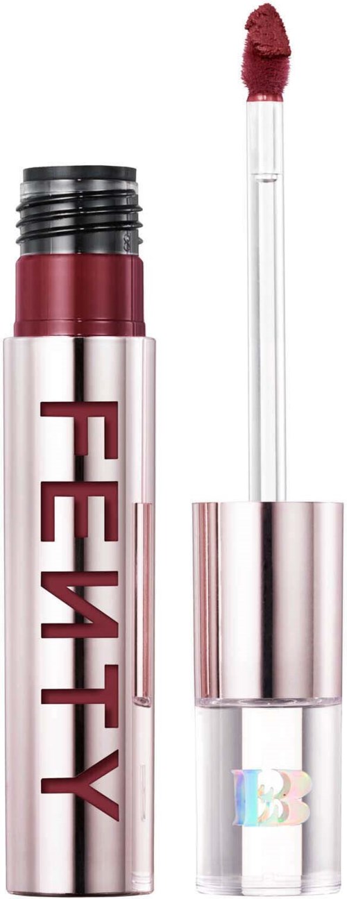 A lipstick tube with an open cap and a pinkish-red lipstick. The tube has the word 'FENTY' printed on it.
