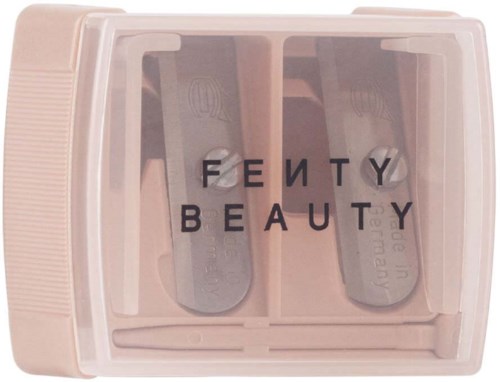 A pink makeup palette case with a transparent cover and the words "FENTY BEAUTY" on it.