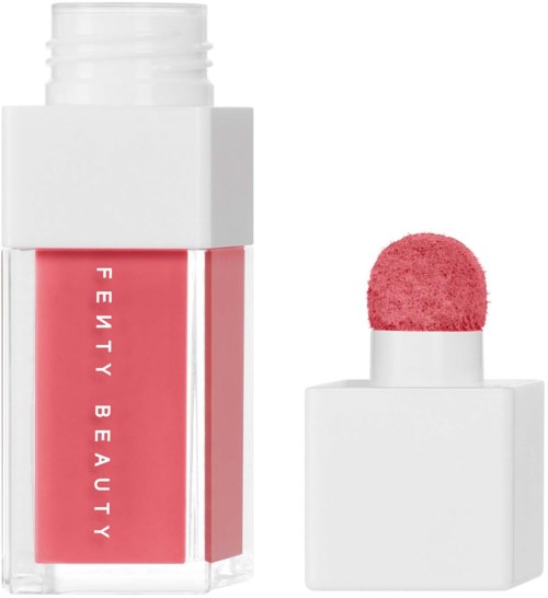 A lipstick bottle with a pink blush applicator on top and a red label reading 'Fenty Beauty' on the bottom.