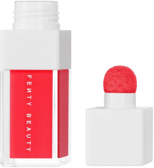 A lipstick product with red brush and white packaging, labeled Fenty Beauty.