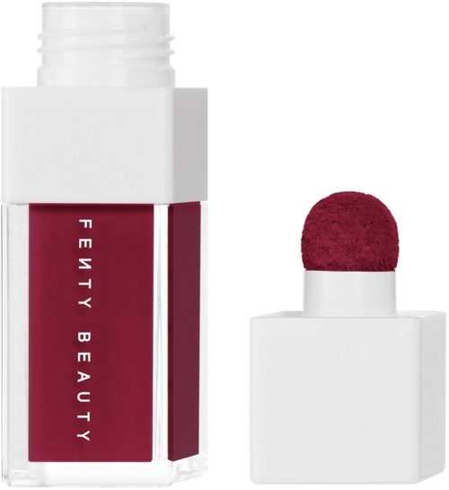 A lipstick bottle with a red cap and a red label that says Fenty Beauty.