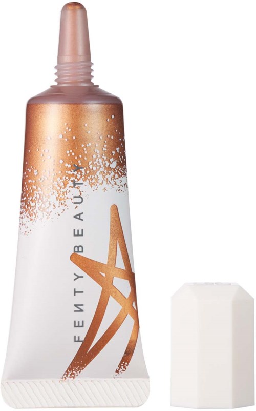 A tube with a rose gold cap, white body, and an abstract design, accompanied by a white sponge.