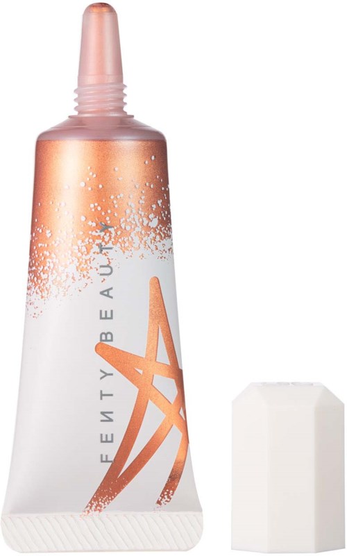 A tube of makeup with a sponge applicator, in white and copper colors, and a large white makeup sponge.