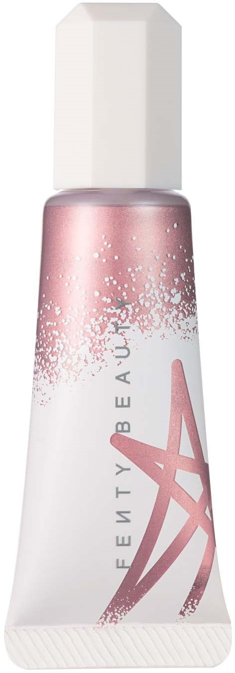 Pink and white tube with a white cap, decorated with pink streaks and speckles, labeled 'FREEDOM BEAUTY A'.