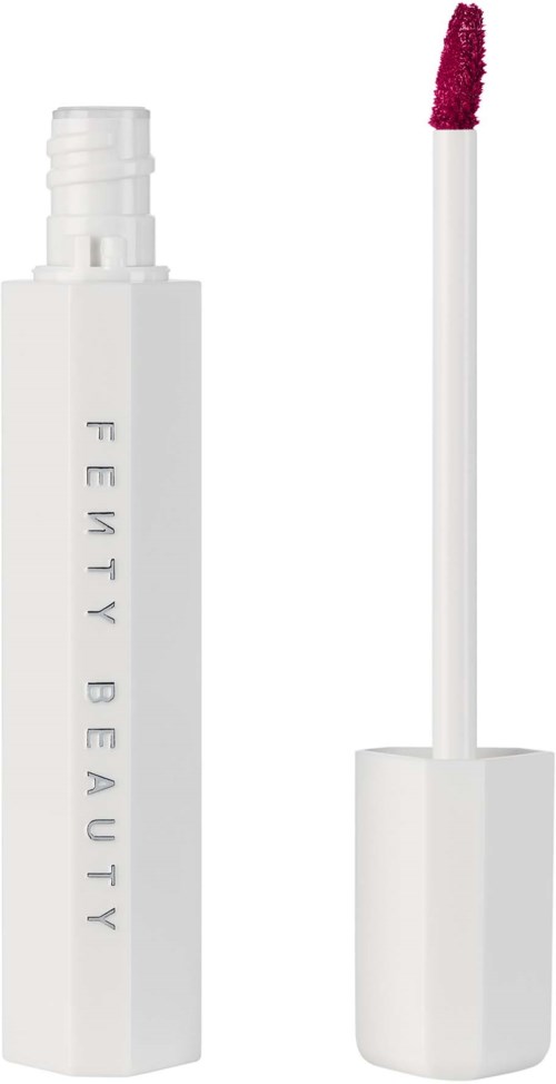 Lip gloss with a white container, the wand shows pink gloss. Fenty Beauty written on the container.