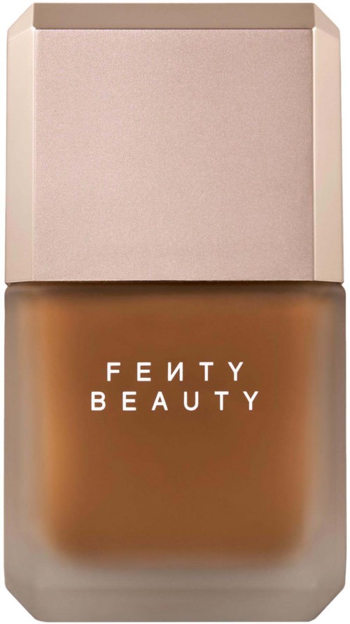 Fenty Beauty foundation flaska med ljus rosa lock och brunt innehåll.