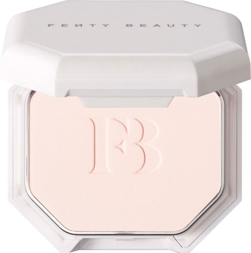 A Fenty Beauty makeup compact with light pink pressed powder and embossed logo.