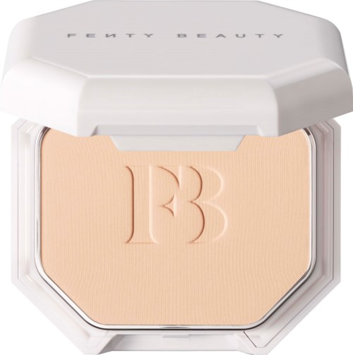 A compact with a beige powder and embossed 'FB' logo, labeled 'Fenty Beauty,' in a white case.