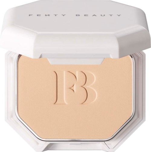 A compact Fenty Beauty powder with the brand name and embossed 'B' on the powder surface.
