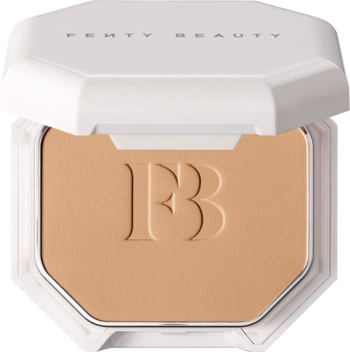 A compact of Fenty Beauty face powder with a white lid and embossed initials 'FB'.