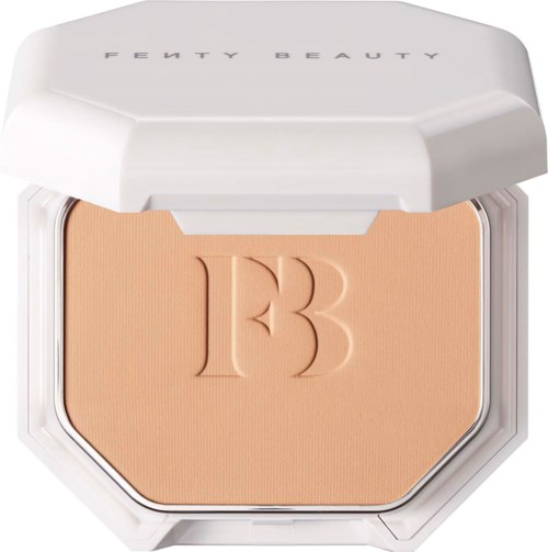 A compact with Fenty Beauty logo on the lid, containing pressed powder or blush, in a white case.