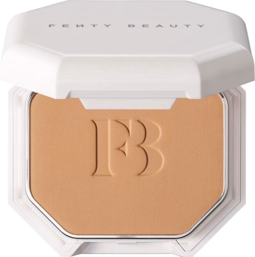 A compact with a beige pressed powder, embossed with a '13' logo, and a white lid labeled 'FENTY BEAUTY.'