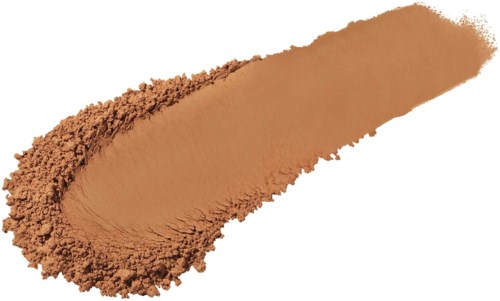 A streak of light brown powder spreads out on a white background, with a rough, uneven edge.
