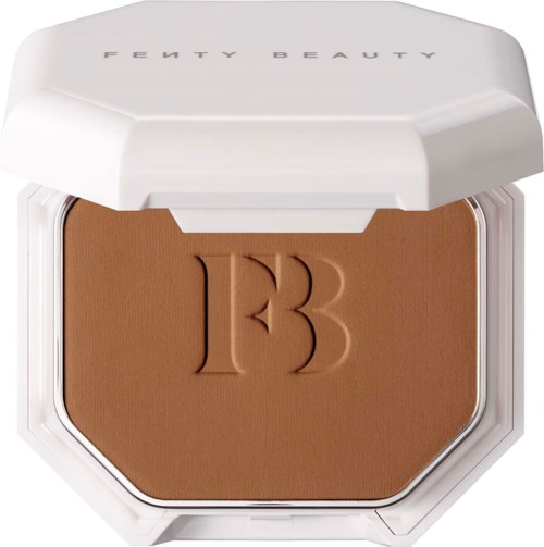 A compact makeup compact with the number 13 engraved on brown powder, in a white case labeled Fenty Beauty.