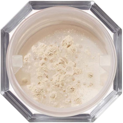 Powdered product inside a glass container, viewed from above, with a hexagonal frame around it.