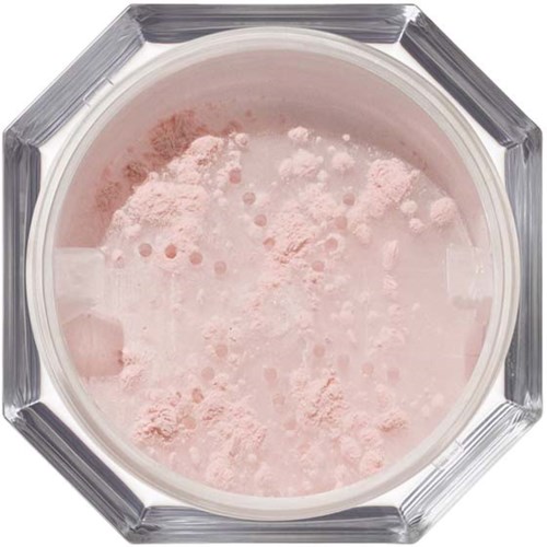 Pink powder inside a round glass container with a geometric edge.