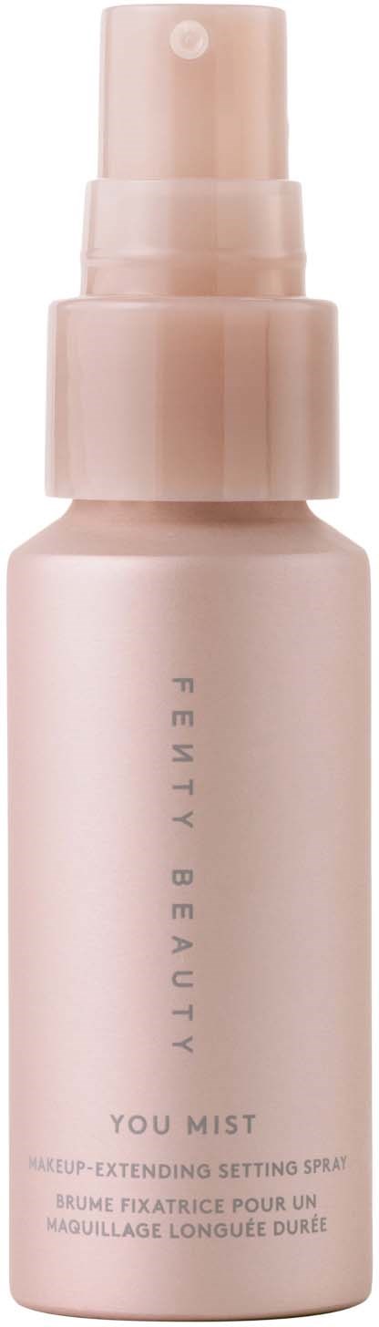 A pink spray bottle labeled 'Fenty Beauty You Mist' for setting makeup.