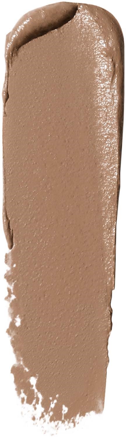 A swatch of beige-brown makeup or foundation with a slightly curved shape and textured surface.