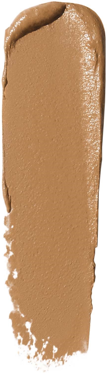 A beige or light brown creamy substance spread out in an elongated shape.