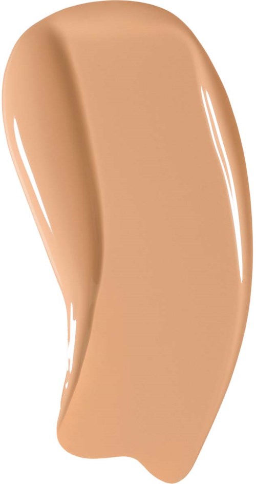 Ett beige flytande foundationprov utbrett i en böjd form.