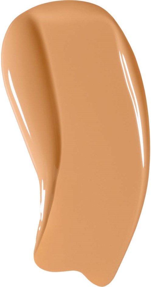 En beige färgad flytande foundation i en kurvig form.