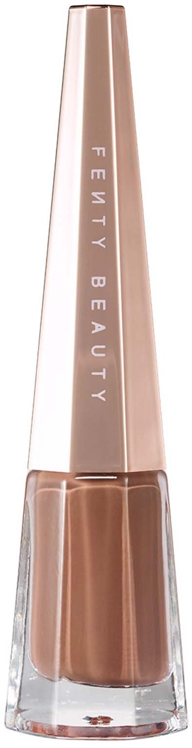 A beige lipstick in a clear tube with a shiny, gold cap, and the brand name 'Fenty Beauty' written on it.
