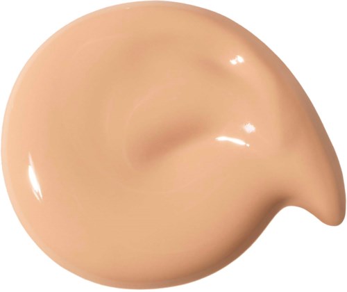 En beige, hudliknande droppe med en spetsig ände, liknande en tårform.