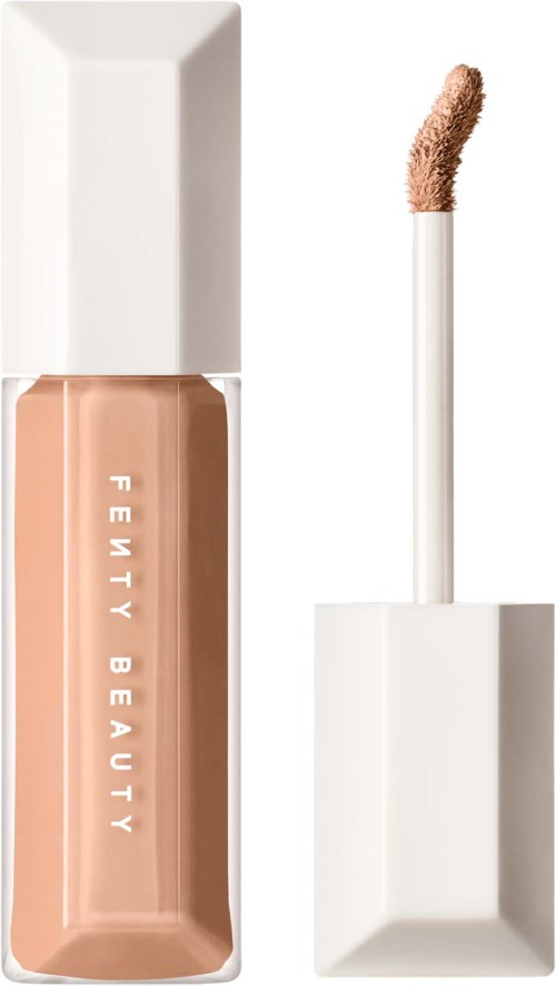 En flytande foundationflaska med en applikator och vit lock från Fenty Beauty.
