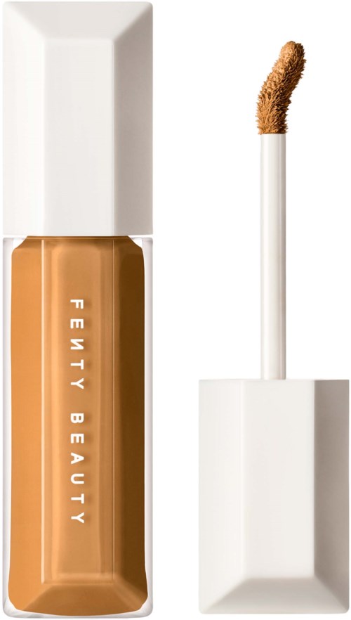 En flaska foundation med en borstapplikator och vit kork, märkt 'Fenty Beauty'.