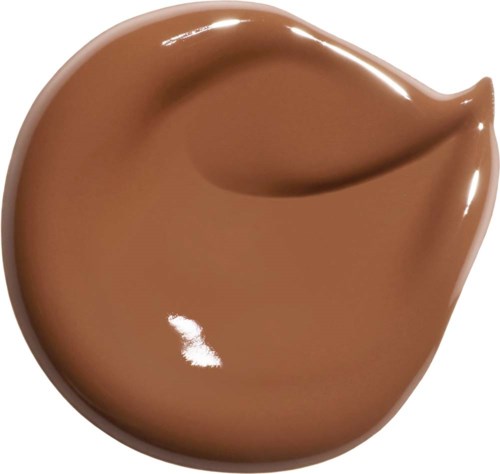 En klick av slät, brun vätska, formad som en tårdroppe eller choklados eller kosmetikkräm.