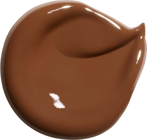 En virvel av slät, glänsande ljusbrun choklad med en glansig yta och ett litet ljusreflex.