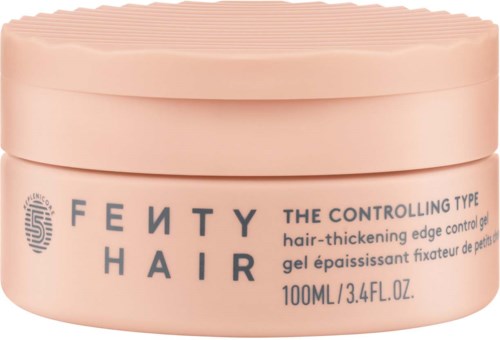 A pink container of Fenty Hair gel, labeled as "The Controlling Type," for hair thickening, 100ml.