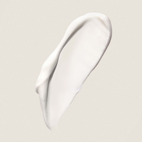 A dollop of white cream on a plain background, smooth and creamy texture.