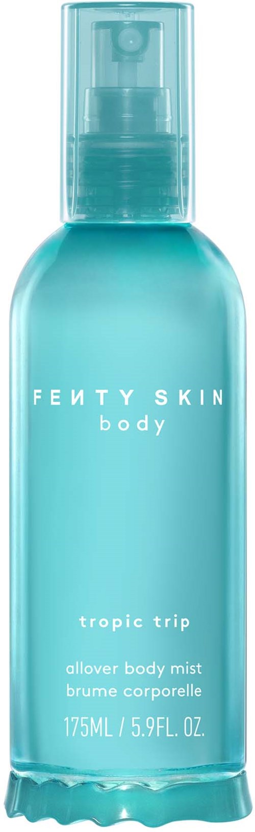 A blue spray bottle of Fenty Skin body mist called Tropic Trip displayed with a clear cap and labeled text.