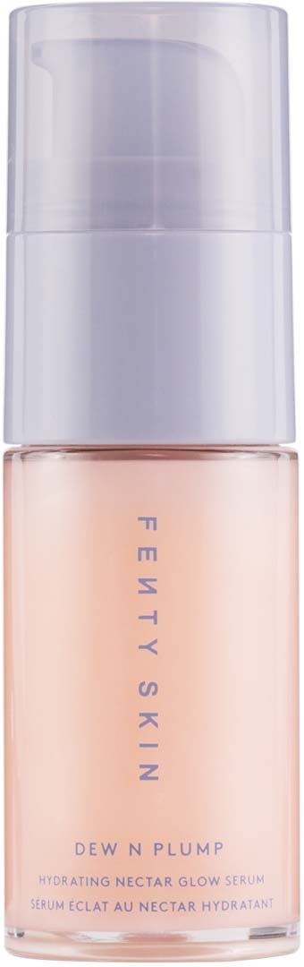 A skincare bottle with a pump, labeled 'Fenty Skin Dew n' Plump Hydrating Nectar Glow Serum.'