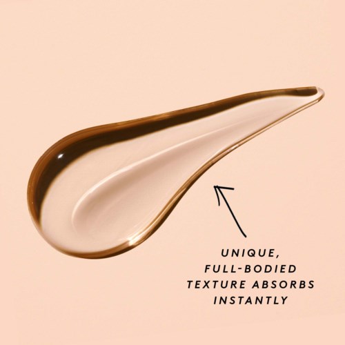 A spoon-shaped object with a brown top and shiny silver bottom, described as absorbing texture instantly.