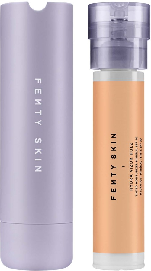 A purple cylindrical bottle and a clear container with beige liquid, both labeled Fenty Skin. The bottle is tall and sleek, the other has a pump.