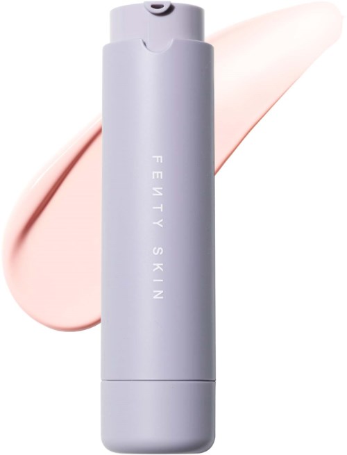 A light purple beauty device with the words 'FENTY SKIN' written vertically and a peach-colored cream in the background.