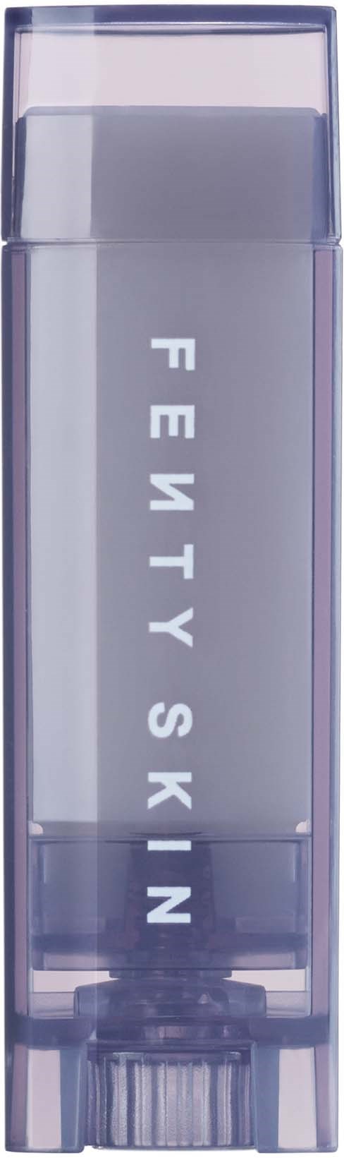 Clear lip gloss container with 'FETY SKIN' written vertically on it.