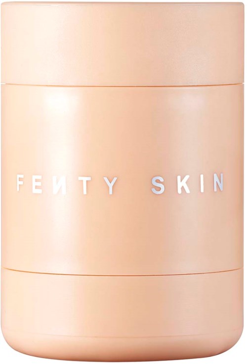 A round, peach-colored jar with the words "FENTY SKIN" on it, likely a skincare product container.