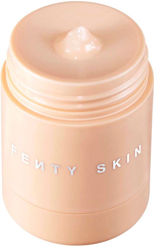 A beige skincare jar with 