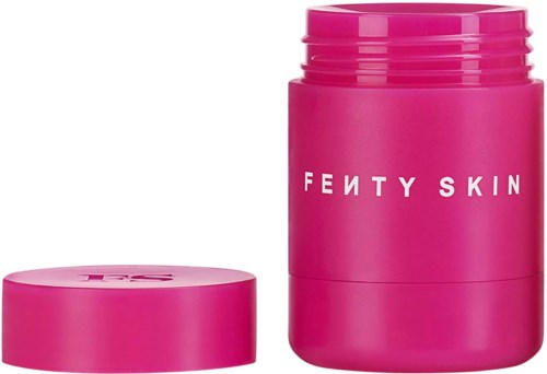 Pink container with a lid, labeled Fenty Skin, likely a cosmetic product.