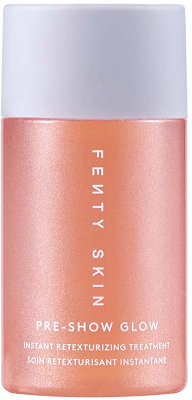 A peach-colored bottle with a white cap, labeled 'Fenty Skin Pre-Show Glow' for skin treatment.